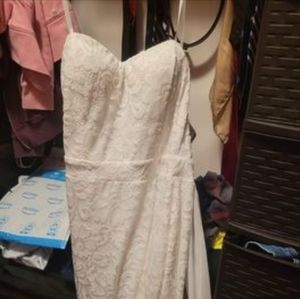 Lace white train dress. Never worn. New without tags. Not hemmed.